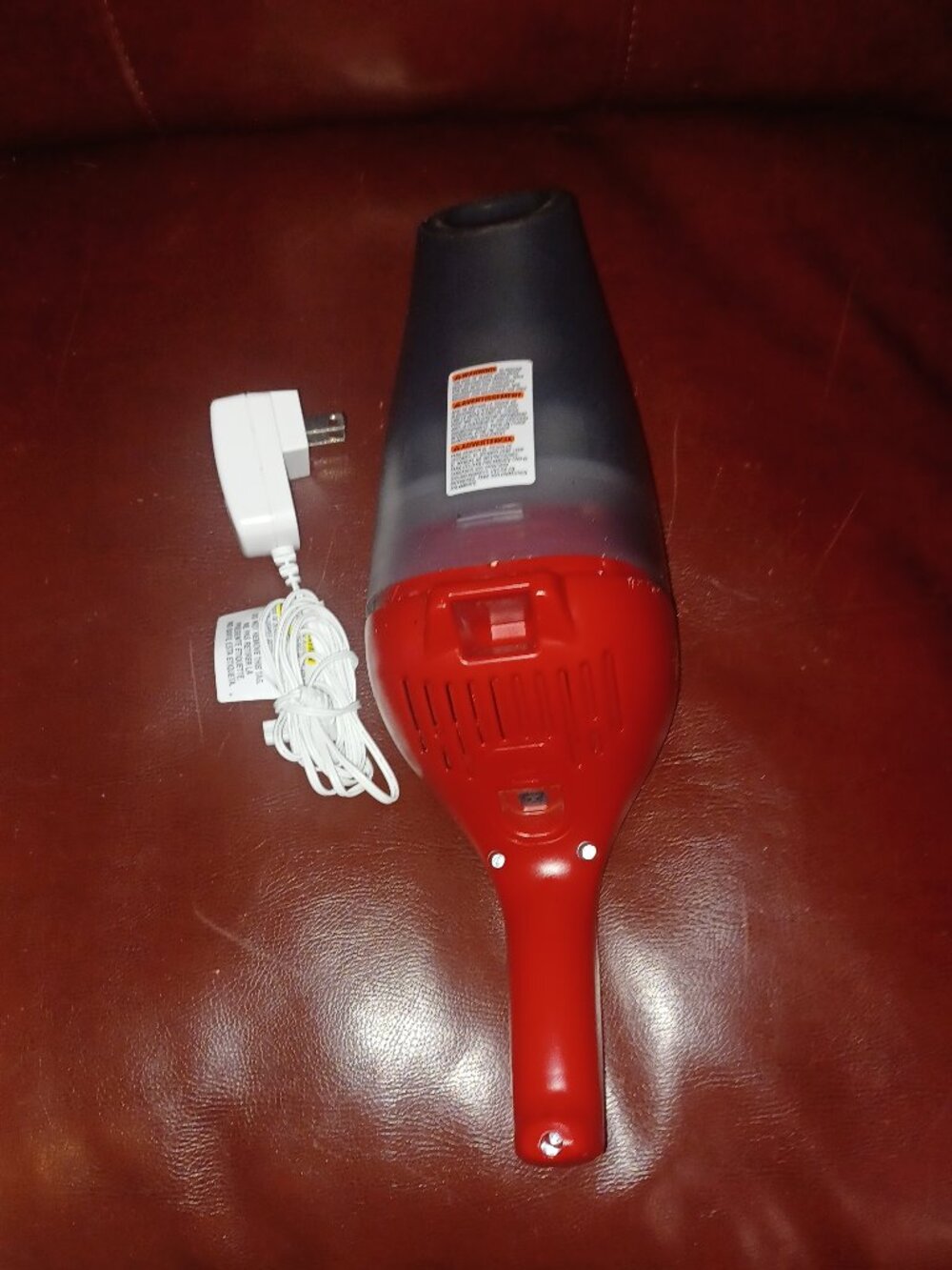Red Black & Decker portable charging vacuum